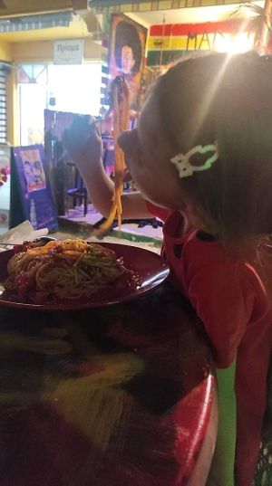 Picky 7 years old enjoys her food!!! The Best Spaghetti Ever she claimed.  at Mad Irie in Crete