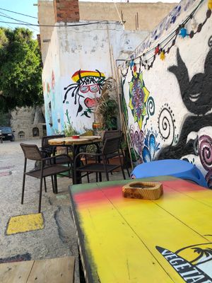 Spot the happy cow sticker next to the happy cow painting! at Mad Irie in Crete