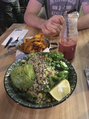 Avocado quinoa salad bowl, chips and a berry smoothie at Mingle Cafe in Larnaca