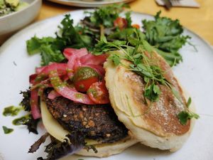 Vegan burger with mushroom pattie and pesto at Noshi Coffee in Porto