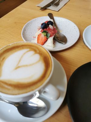 Coffee with coconut milk, vegan cheesecake at Noshi Coffee in Porto