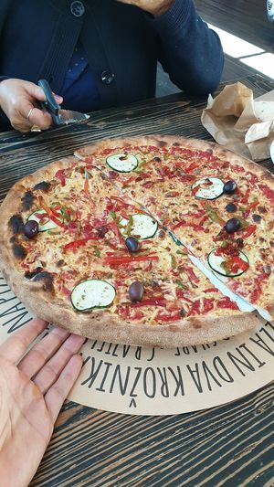 Pizza with vegan cheese and peanuts at La Pizzeria in Maribor