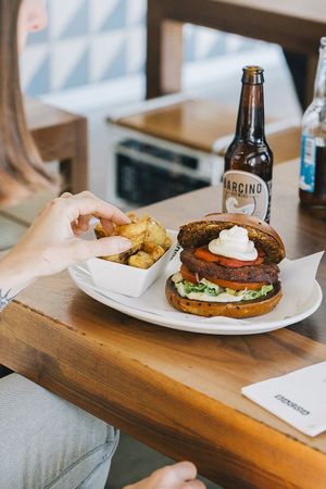 The Blackbean burger, hand made blackbean patty, roast red pepper and cream cheese. at Little Bacoa in Barcelona