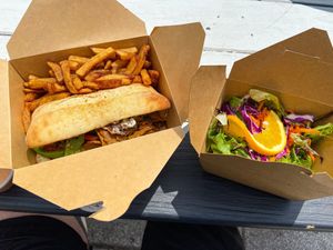 Cheesesteak, fries and salad   at Lola Rosa - Places des Festivals in Montreal