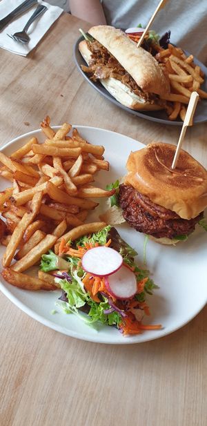 Cajun burger with fries and side salad at Lola Rosa - Places des Festivals in Montreal