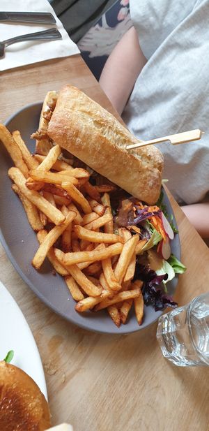 CheeseSteak Sandwich with fries and side salad at Lola Rosa - Places des Festivals in Montreal