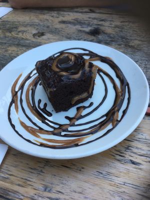 Brownie with chocolate syrup and on syrup  at Lola Rosa - Places des Festivals in Montreal