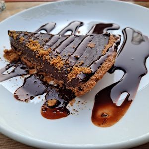 Chocolate Caramel Tarte served on a graham base, garnished with caramel and pecans 😍🥰😋🎉 at Lola Rosa - Places des Festivals in Montreal