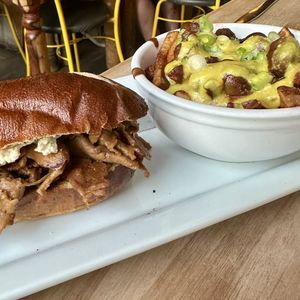 Cheesesteak with side of Poutine  at Lola Rosa - Places des Festivals in Montreal