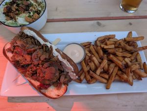 Cheesesteak and fries at Lola Rosa - Places des Festivals in Montreal