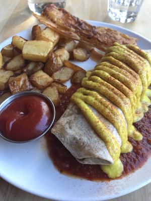 Breakfast burrito with breakfast potatoes and rice bacon  at Lola Rosa - Places des Festivals in Montreal