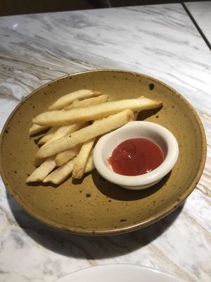 Chips and ketchup (comes with mushroom tempeh burger)  at Just Vegan in Shenzhen