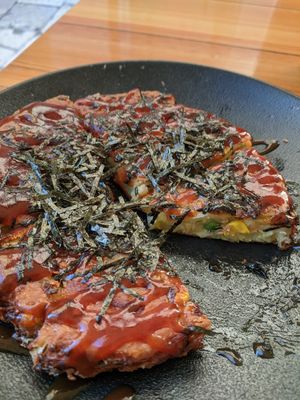 Okonomiyaki tasted like it was reheated from frozen. Had carrots corn and peas inside. at Silk in Split