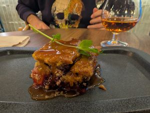 Pear berry crumble with salted caramel sauce. Nice moscatel too! at The Green Affair - Saldanha in Lisbon