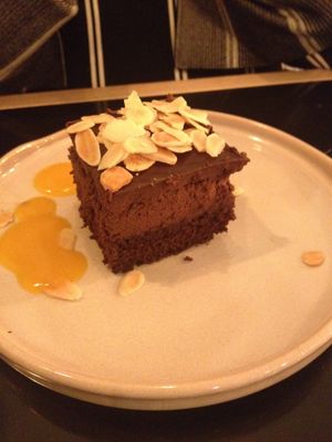 Chocolate cake with three layers and a mango coulis at The Green Affair - Saldanha in Lisbon