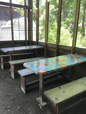 Tables in screened dining at El El Frijoles in Sargentville