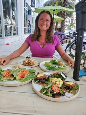 A very happy me with all my food 🤣 (it was shared but so good I could have definitely eaten it all myself!) at Rawk Star Cafe in St Petersburg