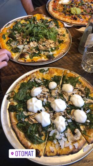 The two vegan pizzas together and top right is vegetarian nacho pizza.  at Otomat in Ghent