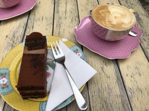 Veganer dark chocolate cake with (soy milk) cappuccino   at Isabella Glutenfreie Patisserie in Aachen