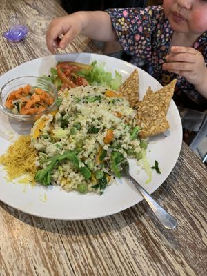 Nasi goreng - yummy, great for my 2 year old! It looked nicer when it was brought out, I messed it up to start cooling it down for my daughter :) at Earth Cafe and Market in Seminyak