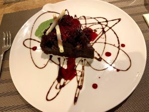 Vegan dessert: chocolate cake with berries  at Da Vinci Italian Restaurant in Aberdeen