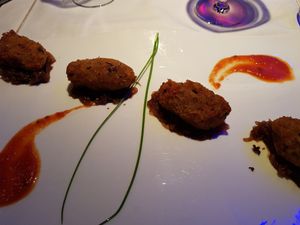 Vegetable patties with caramelized onion mousse and smoked tomato. Divine. at RossoVivo Primaluna in Malcesine