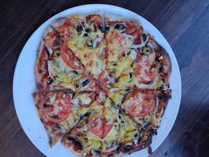 פיצה עם מגוון תוספות עשיר at Alf in Haifa