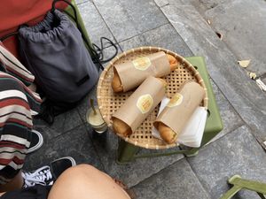 Outdoor setting, eating like a local at Banh Mi 25 in Hanoi