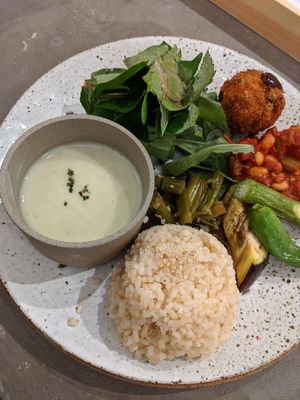 lunch deli plate: gazpacho, brown rice, salad, three assorted cooked veggie dishes, bean & tomato sauce dish, and "veggie cutlet" which was basically a croquette at Vegimo 野菜食堂 in Hiroshima