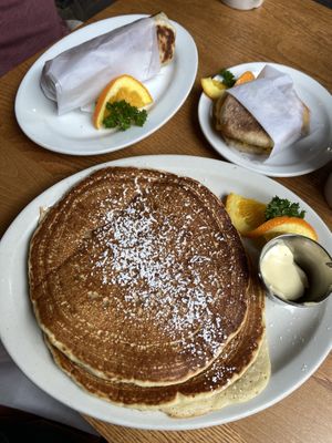 Short stack pancakes, breakfast burrito, and breakfast sandwich.  at The Wild Oat in Bellingham