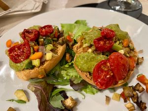 Frisella (Puglian crunchy bread) with vegetables, tomatoes, and pesto.  at Komera in Monopoli