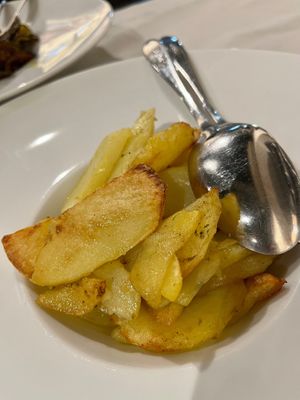 Roasted potatoes with wild herbs.  at Komera in Monopoli