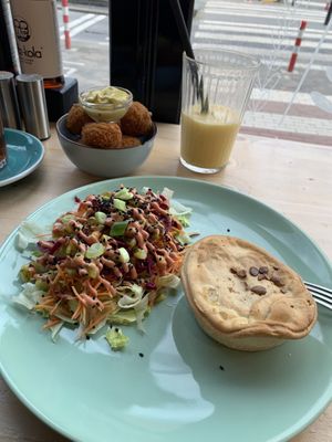 Lentil pot pie with side salad included, side order of bitterballen, and smoothie  at The Black Cockatoo in Almere