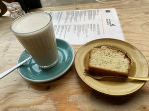 Chai latte and lemon/poppy cake: both tasty and sweet. at The Black Cockatoo in Almere