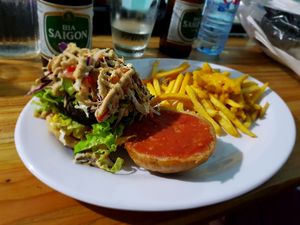 Vegan bean burger and fries with an incredible cheese sauce at Vegan Beets in Hoi An