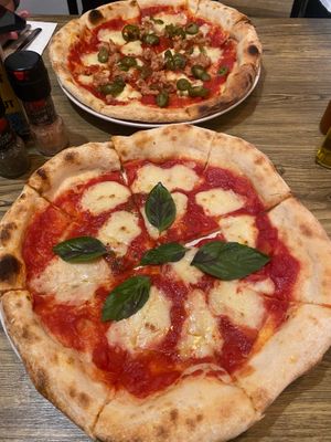Vegan margherita pizza at the front, vegan diavola pizza at the back (with Omnipork!) at The Hungry Wolf in Koh Samui