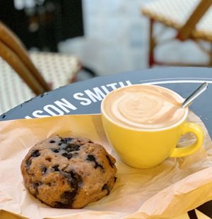 Oat mylk cappuccino and vegan blueberry muffin at La Maison Smith in Quebec