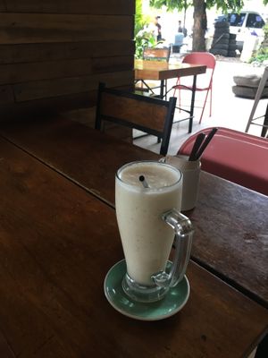 Yummy banana shake on the patio! at Monkey Grounds Coffee in Iloilo City