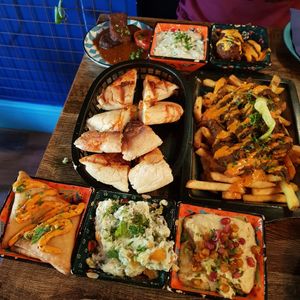 Kofte, samosas, hummus, tzatziki, harissa flatbread, vegetable fitters, Sophia salad, kebab fries at Koocha Mezze Bar in Bristol