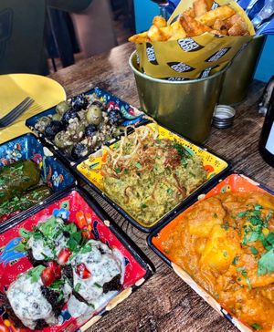 Olives, special fries, eggless kookoo, potato stew   at Koocha Mezze Bar in Bristol