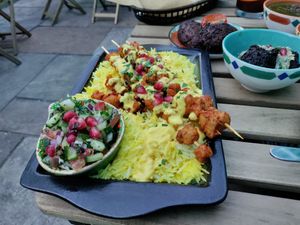 Chikin skewers on delish saffron rice with saffron yogurt. at Koocha Mezze Bar in Bristol