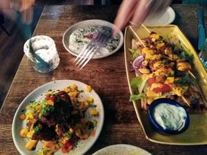 skewers on the right, tzatziki top at Koocha Mezze Bar in Bristol