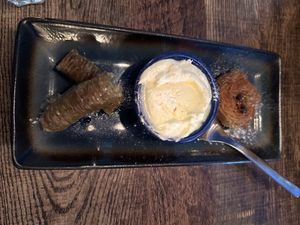 Baklava with whipped cream   at Koocha Mezze Bar in Bristol