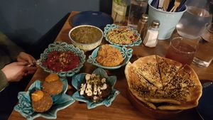 Delicious mezze to share - koopa, eggless kookoo, zaatar flatbread,  beetroot dip, sweet potato with garlic and gormeh sabzi at Koocha Mezze Bar in Bristol