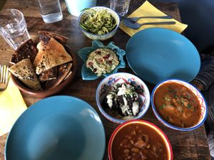 Zattar flatbread (left), courgetti pasta (top), artichoke dip (middle), eggless kookoo, bamieh (right), gaymeh (bottom) at Koocha Mezze Bar in Bristol