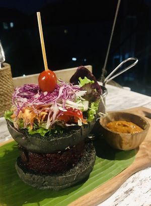 OM burger on a black rise bun at OM Burger in Pecatu