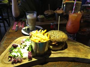 Vegan burger at the back, veggie burger at the front. at The Magic Roundabout in Bowness-on-windermere