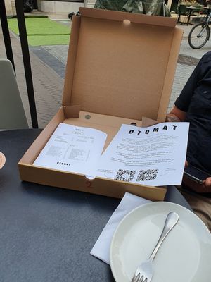 box with menu and fork and knife etc at Otomat in Leuven