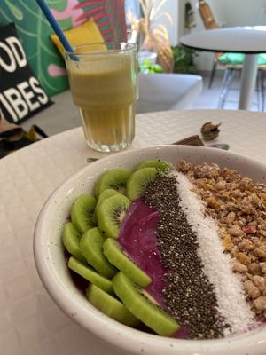 Pitaya (dragon fruit) smoothie bowl with granola, coconut and kiwi  at Happy Blender in Athens