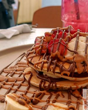 Pancakes, guilty : Peanut buter, banana, vegan nutella, and strawberries at Happy Blender in Athens